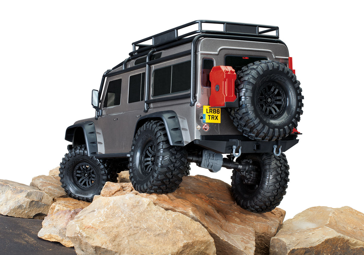 Traxxas TRX-4 Land Rover Defender 82256-4 - Silver 3/4 trasera sobre rocas
